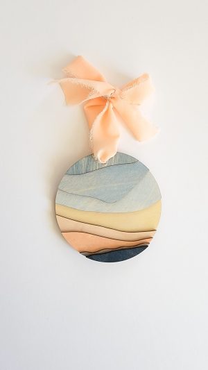 Peach and blue wood layered Christmas ornaments by Meghan Bellamy in Fernie, BC