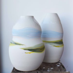 handcrafted wheel thrown small prairie curvy pottery vessel handcrafted by potter Juliana Rempel in a small studio in Canada - landscape design handmade vase or decorative pottery at h squared gallery in Fernie