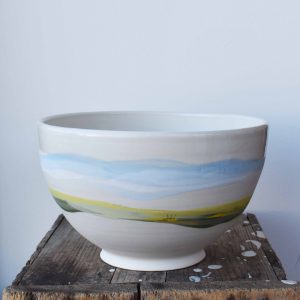 handcrafted ceramic bowls with prairie landscape design using white clay pottery by potter artist Juliana Rempel at h squared gallery downtown Fernie, BC