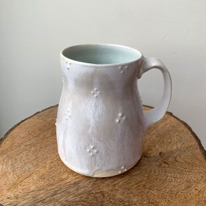 white subtle decal pattern porcelain mug to treat yo self with something nice - at h squared in Fernie BC Canada