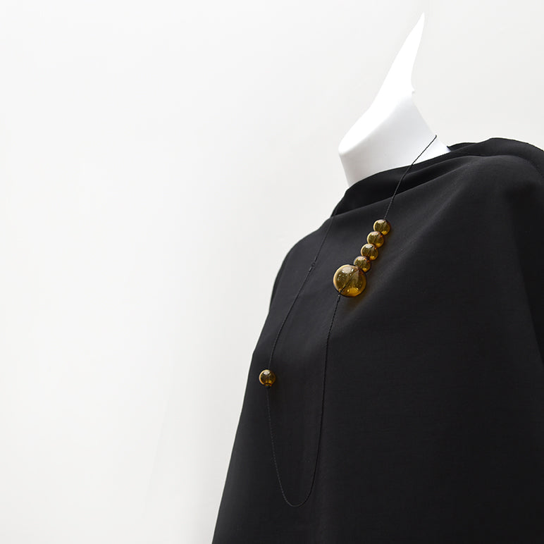 pursuits hand crafted jewellery in Canada - bubbles necklace with black orbs and gold chain.