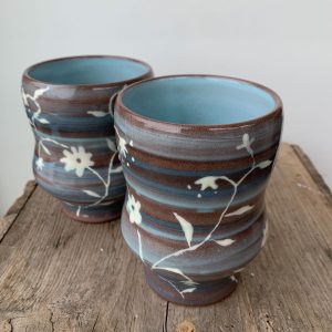Kerri Holmes pottery - floral vine hand painted on a ceramic, wheel thrown tumbler - Canadian potters at h squared gallery in Fernie