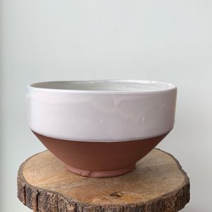 Floral bowl by Juliana Rempel with pink glaze and flowers on the interior. Pottery bowls at h squared gallery in Fernie