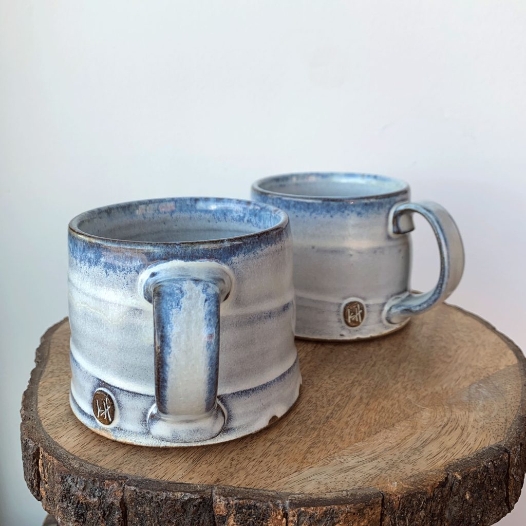 Kerri Holmes pottery at h squared gallery - short titanium mugs in various handle sizes etc