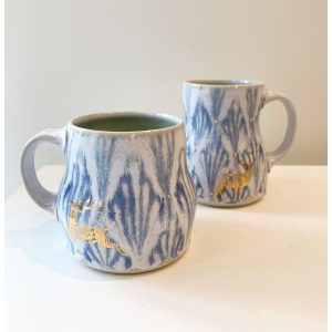 Katy Drijber's porcelain droopy mugs with gold deer decal - standing deer and jumping deer, at h squared gallery in Fernie, BC