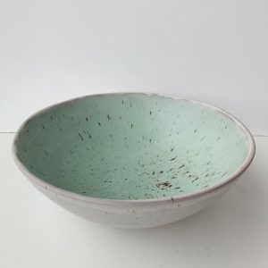 Eryn Prospero's large serving bowls in speckled white finish and turquoise or light mint green glaze