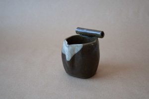 pouring vessel in black clay with white glaze detail by minimal design potter This and That pottery studio Steve Cho in Fernie, BC