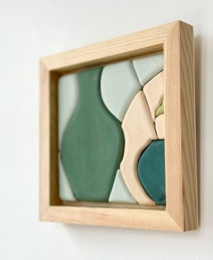Sitting on a Shelf, ceramic tile framed wall art of vases, plate, and flower by Juliana Rempel in green, blue and cream