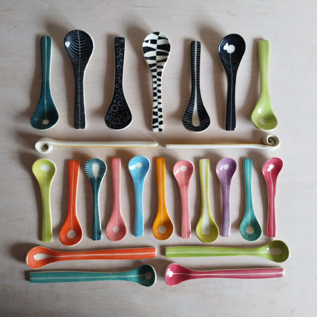 spoon collection by Canadian potter Lori Elling, colourful abstract and geometric designs