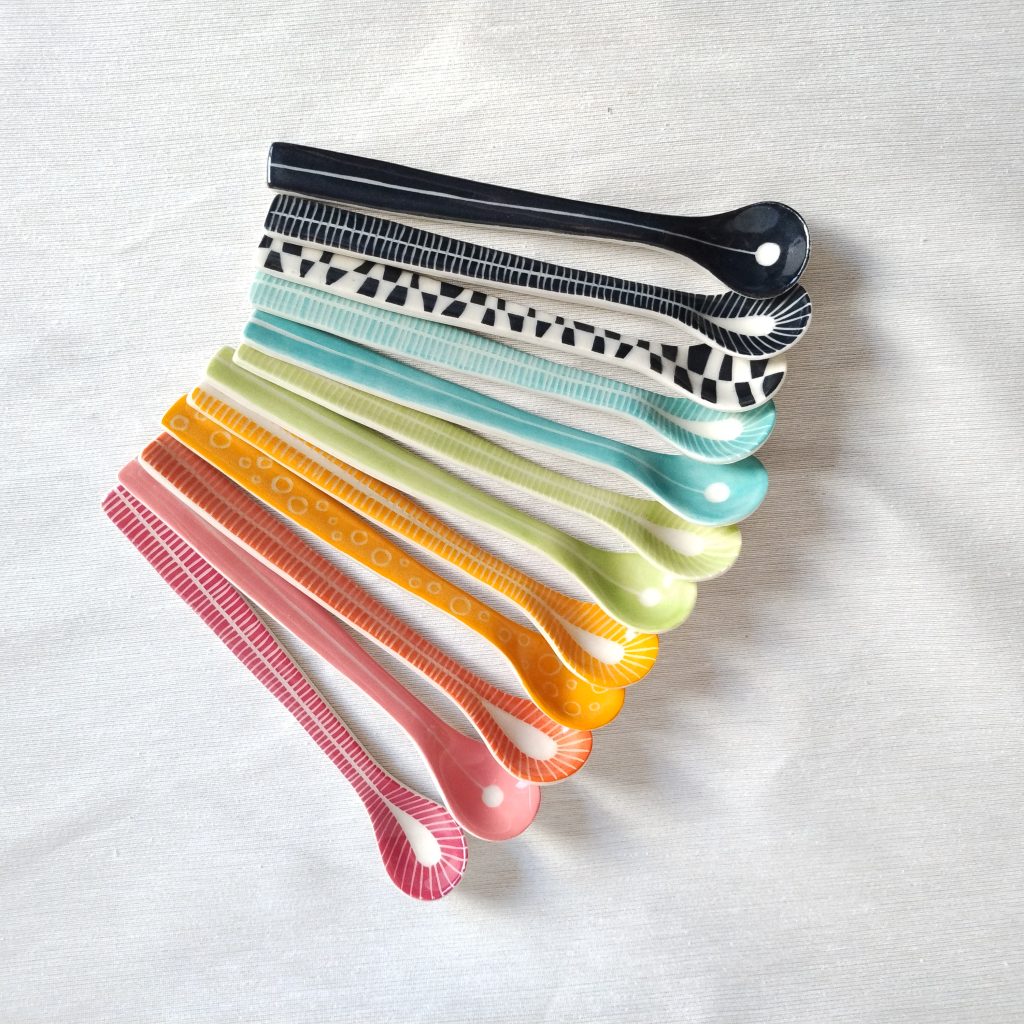 Lori Elling's ceramic spoons in many different sizes, colours, and patterns.