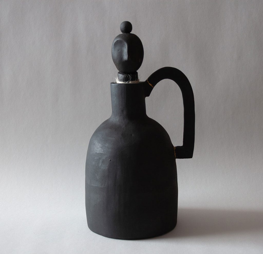 Steve Cho ceramic artist of minimalist design using black clay and natural rope details