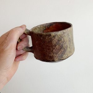 Heather Dynes Smit, hand built potter and wood fired ceramic mug with green and brown hues