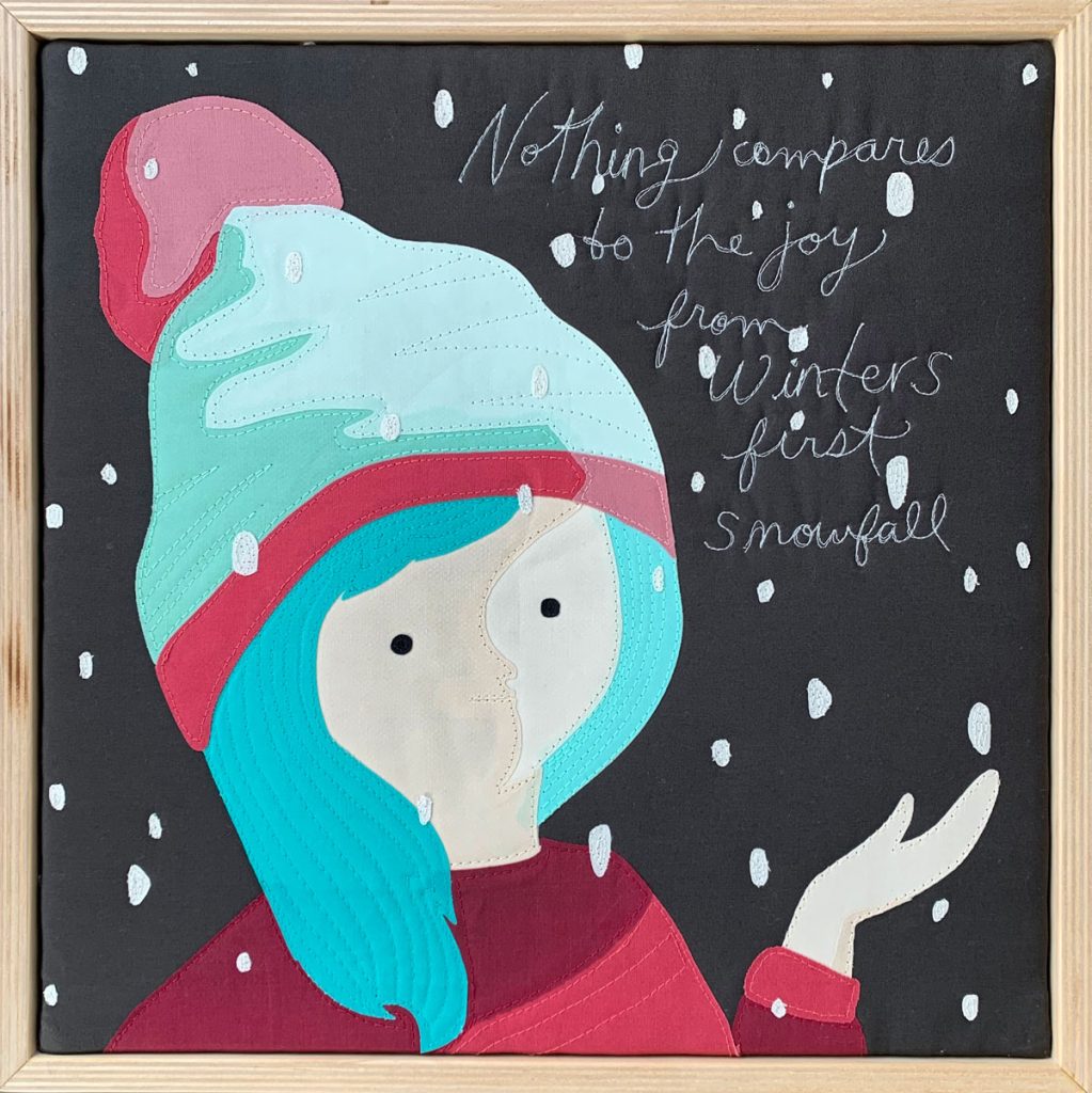 It Never Gets Old, fabric quilt art by Sam Sedlowsky of woman in an evening first snowfall. Stitched by local fabric artist Sam Sedlowsky from Brina Schenk's illustration and words.