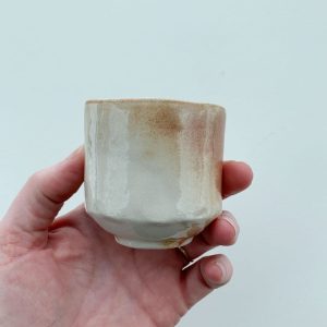 Heather Dynes Smit Canadian potter with hand built, textured, wood fired small sipper at Fernie's art and pottery gallery